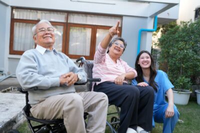 elderly-people-enjoy-time-outside-with-caregiversmall